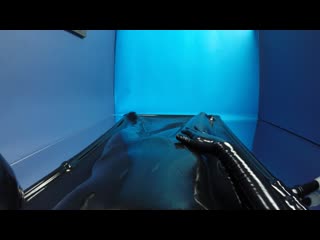 latex guy goes into sleeved vacuum bed